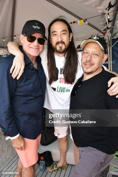 President & chief content officer, SiriusXM, Scott Greenstein, Steve Aoki, and Jonathan Geronimo attend the SiriusXM Music Lounge at 1 Hotel South...