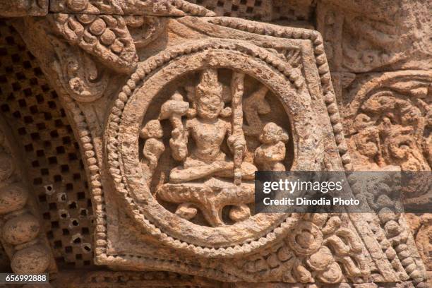 carving details of a wheel at konark sun temple, orissa, india - konark wheel stock pictures, royalty-free photos & images