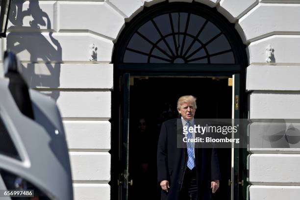 President Donald Trump walks out of the White House to meet truckers and truck industry chief executive officers on the South Lawn of the White House...