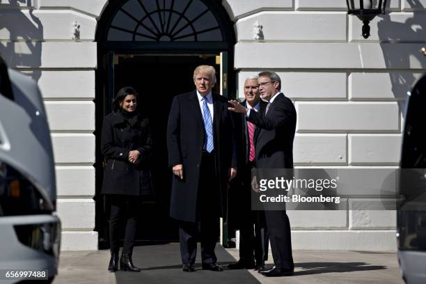President Donald Trump, center, meets Chris Spear, president of the American Trucking Associations , right, during an event to meet truckers and...