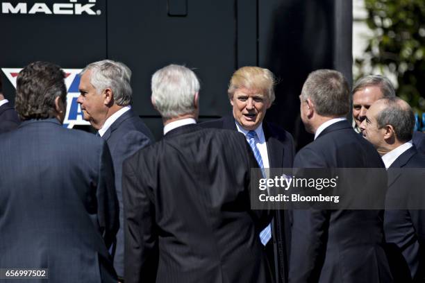 President Donald Trump greets truck industry chief executive officers during an event on the South Lawn of the White House in Washington, D.C., U.S.,...