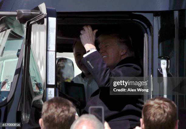 President Donald Trump sits in the cab of a truck and pulls the horn as he welcomes members of American Trucking Associations to the White House...