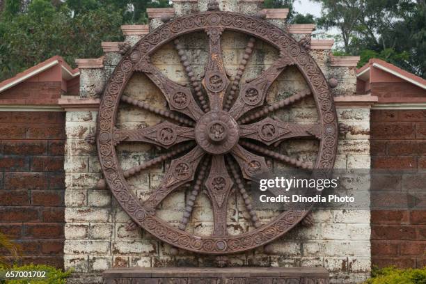 replica of chariot wheel at urban haat handicraft shop at konark, orissa, india, asia - konark wheel stock pictures, royalty-free photos & images