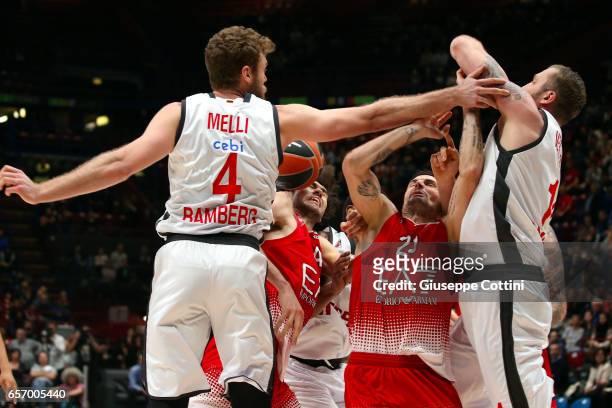 Andrea Cinciarini, #20 of EA7 Emporio Armani Milan competes with Nicolo Melli, #4 of Brose Bamberg during the 2016/2017 Turkish Airlines EuroLeague...