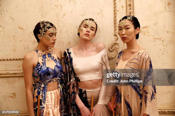 Models pose for a presentation at the Bashaques show during Mercedes-Benz Istanbul Fashion Week March 2017 at Grand Pera on March 23, 2017 in...