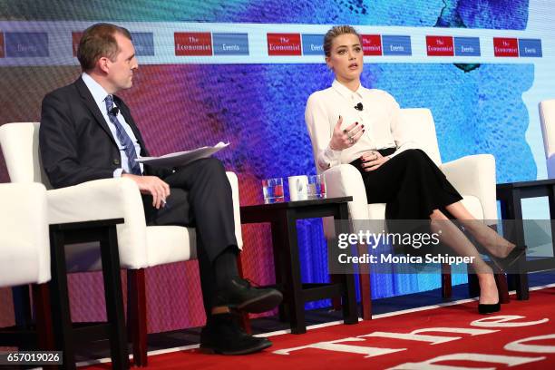 Deputy Editor of The Economist Tom Standage speaks with actress Amber Heard during the 2nd Annual Pride & Prejudice Summit at 10 on The Park on March...