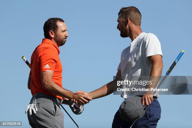Sergio Garcia of Spain shakes hands with Kevin Chappell after winning their match 4&3 during round two of the World Golf Championships-Dell...