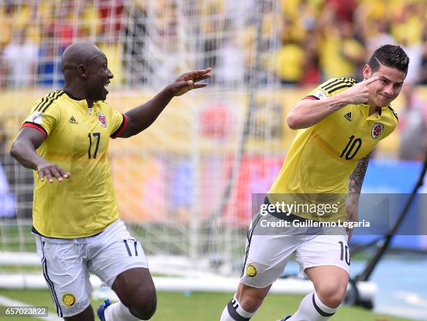 James Rodriguez of Colombia celebrates with teammate Pablo Armero after scoring the opening goal during a match between Colombia and Bolivia as part...