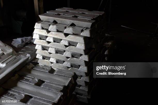Bars of aluminum sit stacked before being melted down in the foundry at the Super Vac Manufacturing Co. Production facility in Fort Collins,...