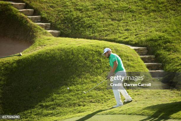 Tyrrell Hatton of England plays a shot on the 17th hole of his match during round two of the World Golf Championships-Dell Technologies Match Play at...