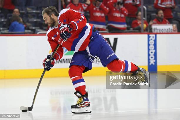 Alex Ovechkin of the Washington Capitals warms up in a custom pair of ice skates before playing the Columbus Blue Jackets at Verizon Center on March...