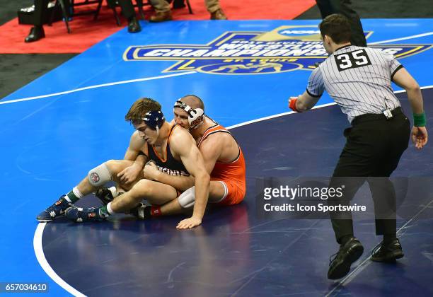 Dean Heil of Oklahoma maintains control of George DiCamillo of Virginia in the finals of the 141-pound weigh class of the NCAA Wrestling...