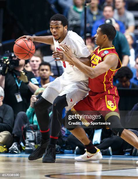 Mustangs guard Sterling Brown posts up on USC Trojans guard De'Anthony Melton during the NCAA Tournament first round game game between the SMU...