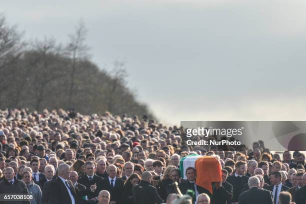The coffin of former Northern Ireland Deputy First Minister Martin McGuinness in procession in the Bogside neighbourhood of Derry on its way from St....
