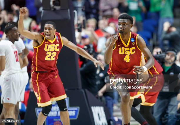 Trojans forward Chimezi Metu and guard De'Anthony Melton celebrate as time expires during the NCAA Tournament first round game game between the SMU...