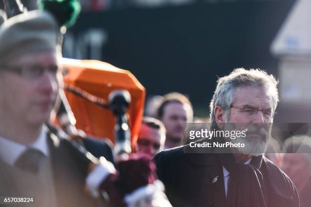 Sinn Fein President Gerry Adams in front of Martin McGuinness coffin from St. Columba's Church Longtower to the City Cemetery. On Thursday, March 23...