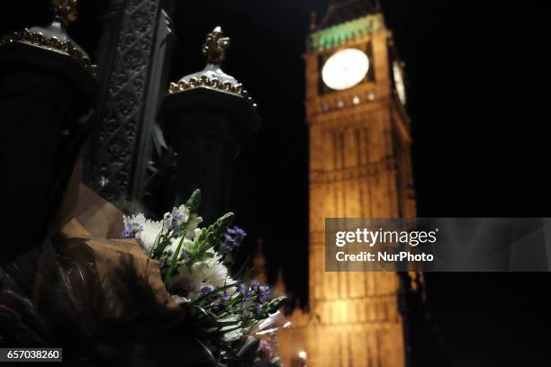 Flowers in front of Big Ben in central London on March 23, 2017 in solidarity with the victims of the March 22 terror attack at the British...