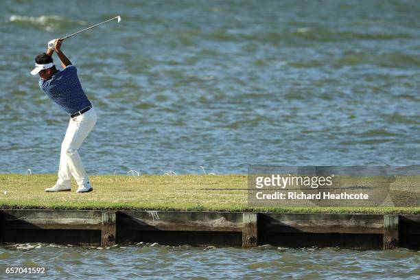 Yuta Ikeda of Japan plays a shot on the 13th hole of his match during round two of the World Golf Championships-Dell Technologies Match Play at the...