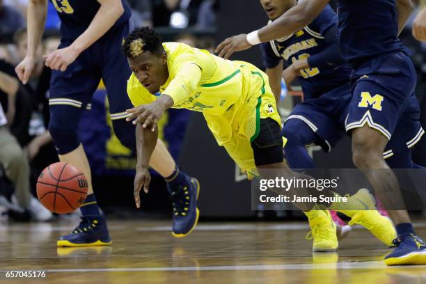 Dylan Ennis of the Oregon Ducks battles for a loose ball in the first half against the Michigan Wolverines during the 2017 NCAA Men's Basketball...