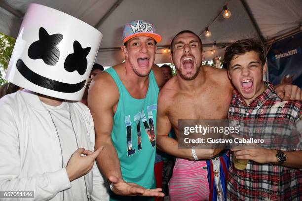 Marshmello, New England Patriots tight end Rob Gronkowski, Mojo Rawley, and Martin Garrix attend the SiriusXM Music Lounge at 1 Hotel South Beach on...