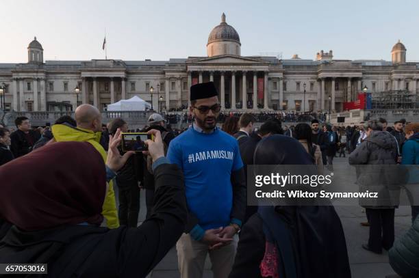 Zishan Ahmad of Ahmadiyya Muslim Association speaks to people about Islam before a vigil in Trafalgar Square in solidarity with victims of the...