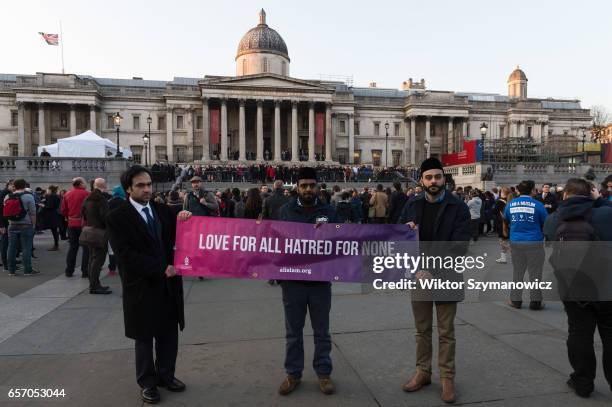 Campaigners from Ahmadiyya Muslim Association attend a vigil in Trafalgar Square in solidarity with victims of the Westminster terrorist attack on...