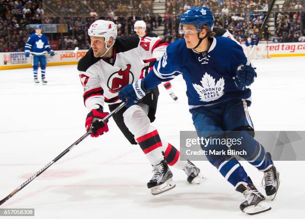 William Nylander of the Toronto Maple Leafs battles for position with Dalton Prout of the New Jersey Devils during the first period at the Air Canada...
