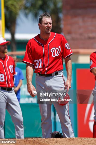 Max Scherzer of the Washington Nationals warms up in the bullpen prior to starting the spring training game against the St Louis Cardinals at Roger...