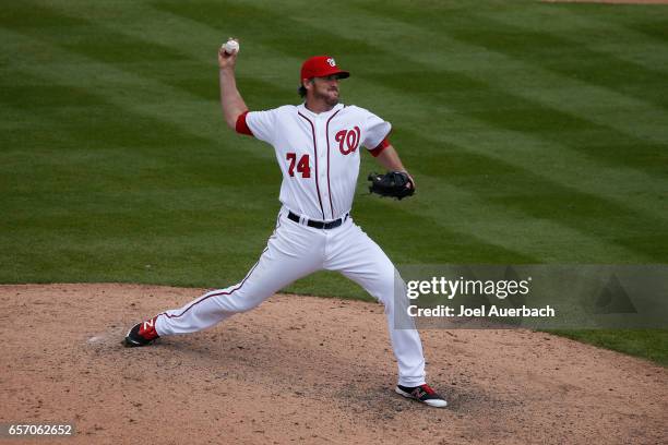 Joe Nathan of the Washington Nationals throws the ball against the New York Yankees during a spring training game at The Ballpark of the Palm Beaches...