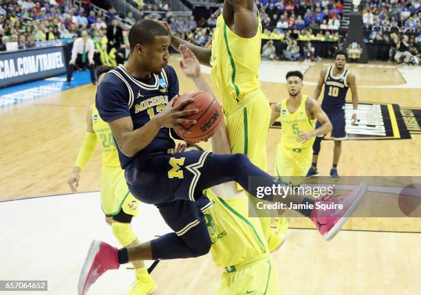 Muhammad-Ali Abdur-Rahkman of the Michigan Wolverines handles the ball in the second half against the Oregon Ducks during the 2017 NCAA Men's...