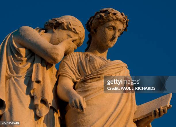 The Peace Monument is seen at sunset March 23 on the grounds of the US Capitol in Washington, DC. - A white marble 44-ft high statue was erected in...