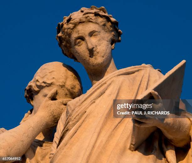 The Peace Monument is seen at sunset March 23 on the grounds of the US Capitol in Washington, DC. - A white marble 44-ft high statue was erected in...