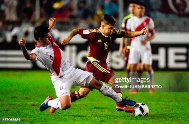 Peru's defender Miguel Trauco vies for the ball with Peru´s midfielder Sergio Pena during their 2018 FIFA World Cup qualifier football match in...
