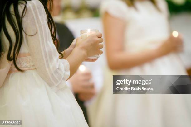 first communion - communion fotografías e imágenes de stock