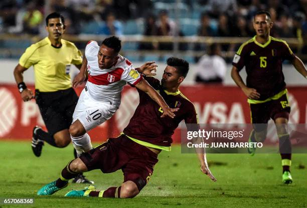 Venezuela's defender Wilker Angel vies for the ball with Peru's forward Christian Cueva during their 2018 FIFA World Cup qualifier football match in...