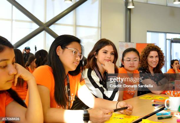 Selena Gomez, Jenni Luke, CEO of Step Up and Coach Surprise Step Up Teens at High Schools on March 23, 2017 in Los Angeles, California.