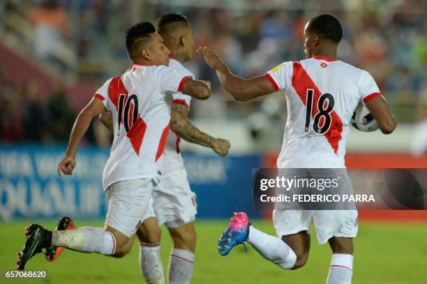 Peru's forward Andre Carrillos celebrates with teammates a goal he scored against Venezuela during their 2018 FIFA World Cup qualifier football match...