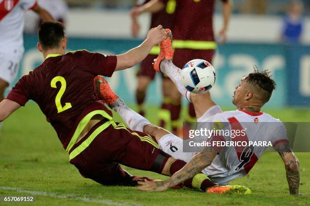 Peru's forward Paolo Guerrero vies for the ball with Venezuela's defender Wilker Angel during their 2018 FIFA World Cup qualifier football match in...