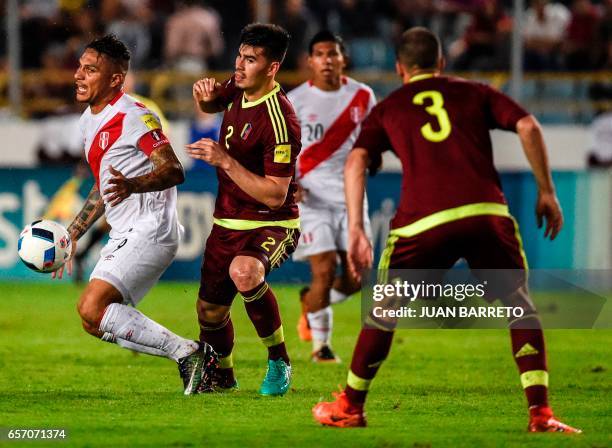 Peru's forward Paolo Guerrero vies for the ball with Venezuela's defender Wilker Angel during their 2018 FIFA World Cup qualifier football match in...