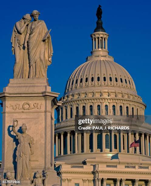 The Peace Monument is seen at sunset March 23 on the grounds of the US Capitol in Washington, DC. - A white marble 44-ft high statue was erected in...