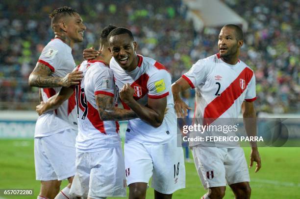 Peru's forward Andre Carrillo celebrates his goal with teammates during their 2018 FIFA World Cup qualifier football match against Venezuela in...