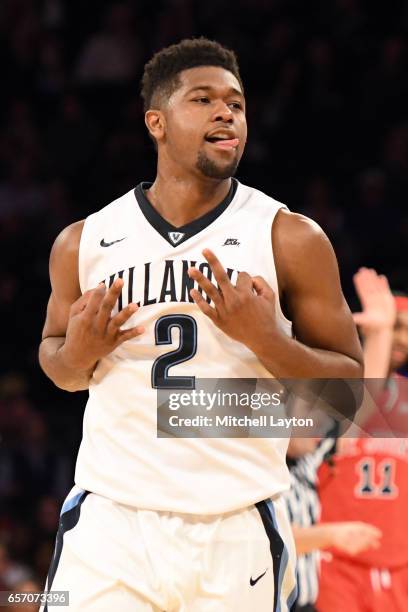Kris Jenkins of the Villanova Wildcats celebrates a shot during the Big East Basketball Tournament - Quarterfinal game against the St. John's Red...