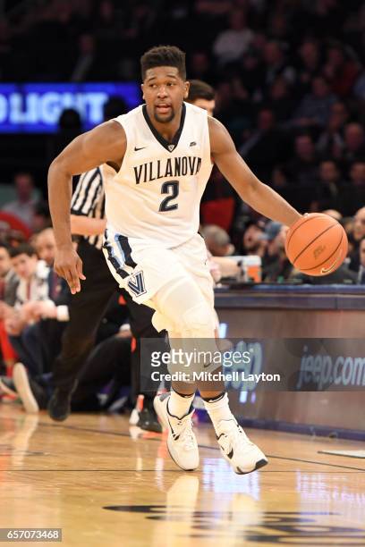 Kris Jenkins of the Villanova Wildcats dribbles up court during the Big East Basketball Tournament - Quarterfinal game against the St. John's Red...