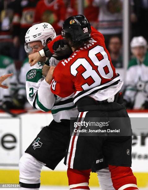 Ryan Hartman of the Chicago Blackhawks and Dan Hamhuis of the Dallas Stars fight in the second period at the United Center on March 23, 2017 in...