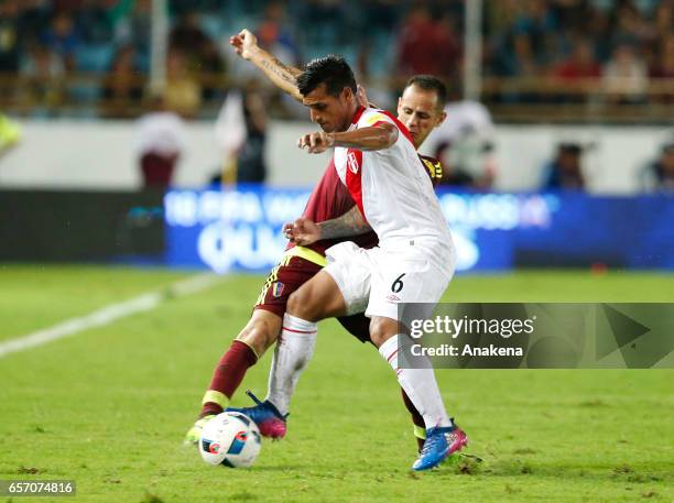 Miguel Trauco of Peru fights for the ball with Alejandro Guerra of Venezuela during a match between Venezuela and Peru as part of FIFA 2018 World Cup...