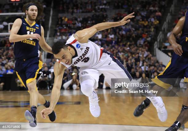 Nigel Williams-Goss of the Gonzaga Bulldogs falls to the ground against the West Virginia Mountaineers during the 2017 NCAA Men's Basketball...