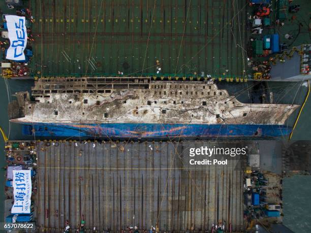 Submersible vessel attempts to salvage sunken Sewol ferry in waters off Jindo, on March 24, 2017 in Jindo-gun, South Korea. The Sewol sank off the...