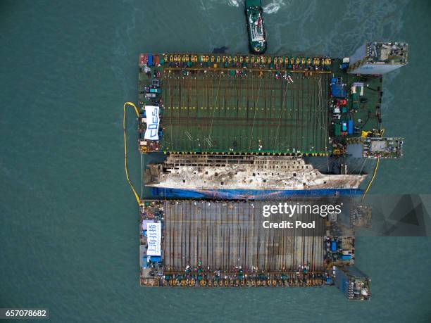 Submersible vessel attempts to salvage sunken Sewol ferry in waters off Jindo, on March 24, 2017 in Jindo-gun, South Korea. The Sewol sank off the...