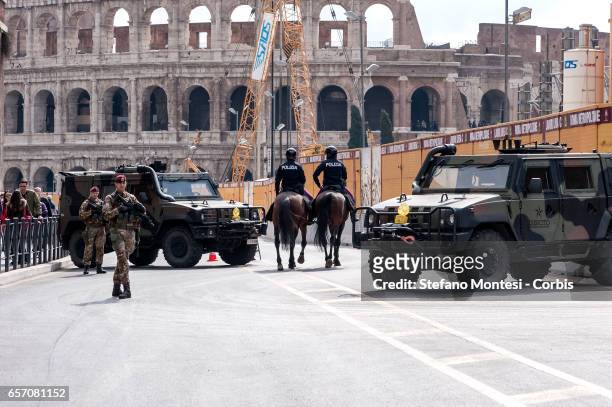 Italian military corps stand guard at a security check-point in front of Colosseum in central Rome on March 23, 2017 in Rome, Italy. The Ministry of...