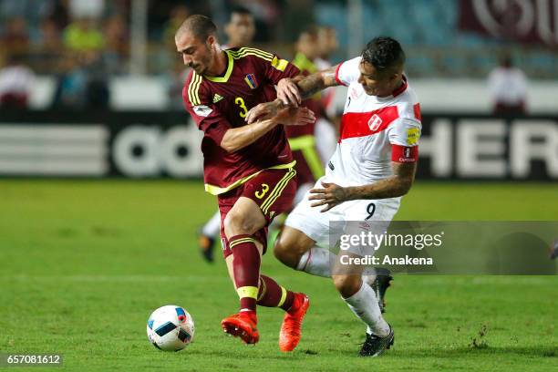 Mikel Villanueva of Venezuela and Paolo Guerrero of Peru fight for the ball during a match between Venezuela and Peru as part of FIFA 2018 World Cup...
